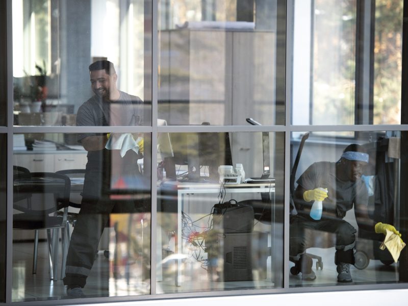 full-shot-smiley-man-cleaning-window (1)